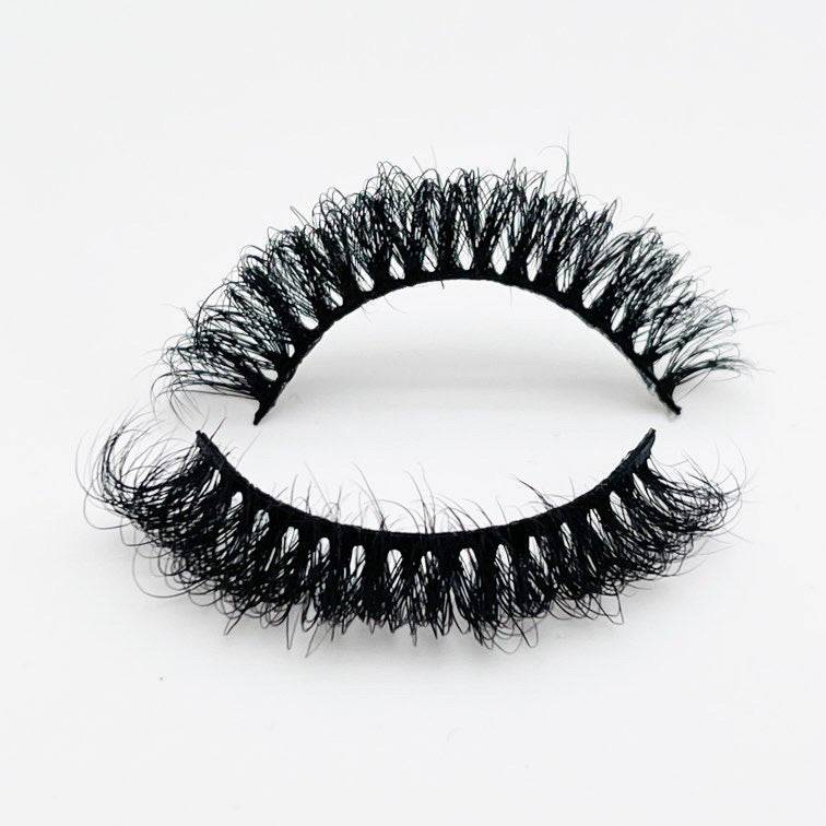 Premium mink strip eyelashes in the style Candy, featuring a fluffy, voluminous design for bold eye makeup looks. Lightweight and durable, ideal for enhancing lash volume.