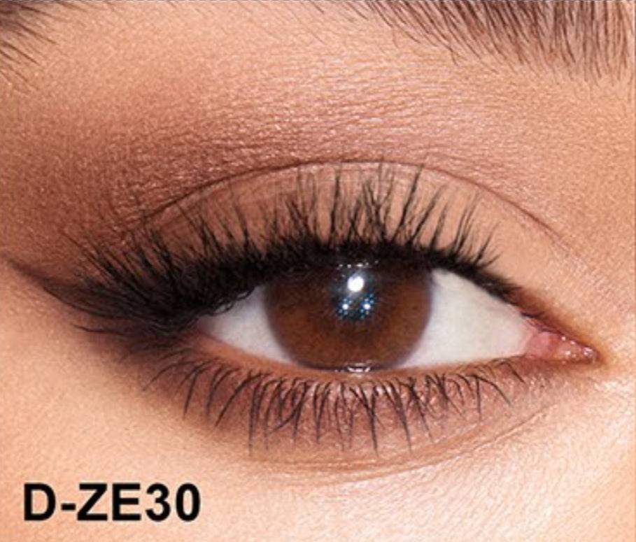 Close-up of an eye wearing Cateye self-adhesive lash clusters with a natural look. Features enhanced viscosity for a secure, long-lasting hold.