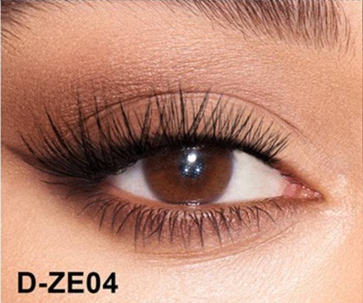 Close-up of an eye wearing Flutter self-adhesive lash clusters with a natural, voluminous look. Perfect for enhancing eye makeup effortlessly.