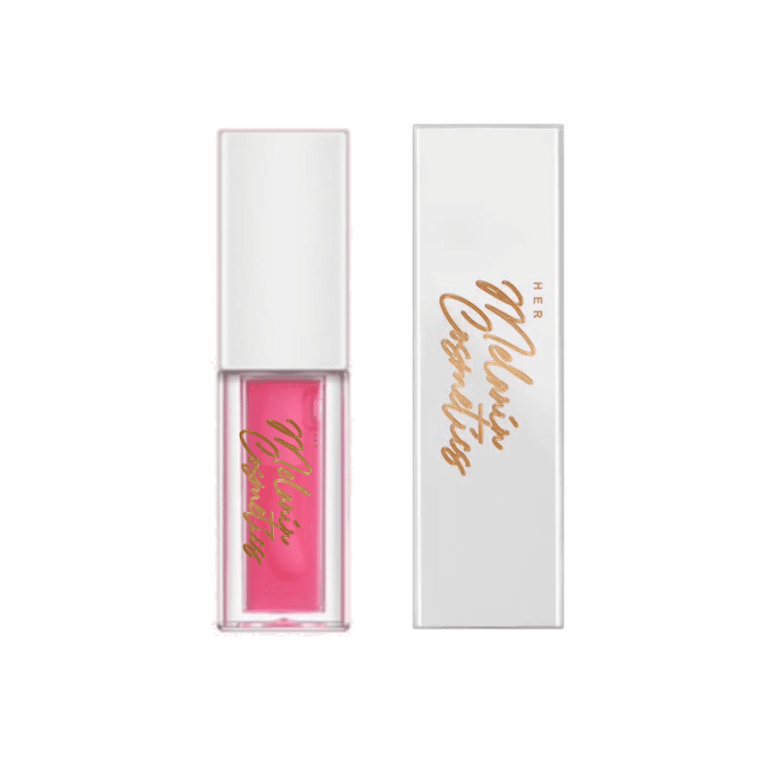 Moisturizing raspberry lip oil in a sleek clear tube with pink tint, paired with elegant white packaging featuring gold lettering.